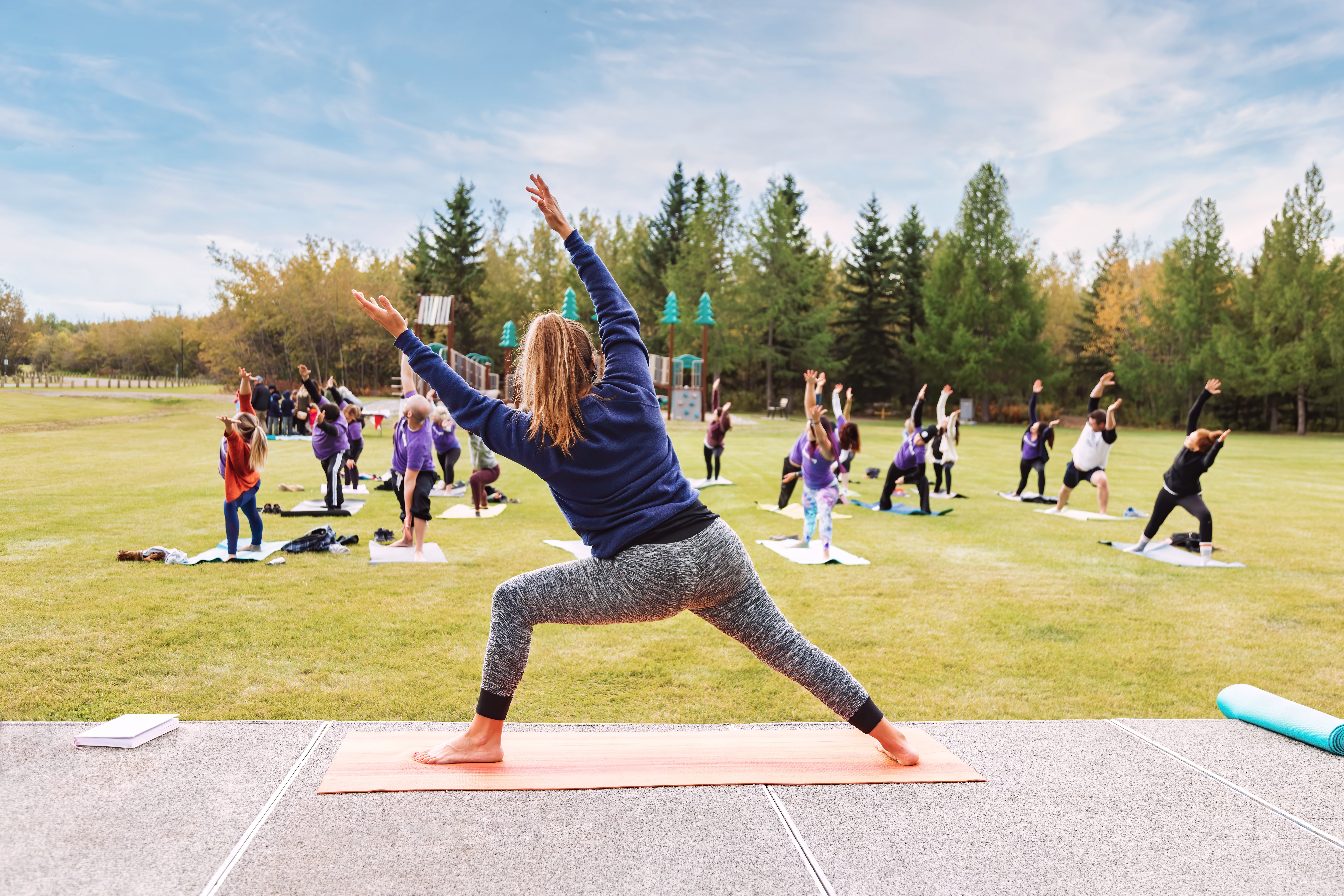 outdoor-yoga-classes-group-of-adults-attending-yo-2021-08-27-15-54-55-utc