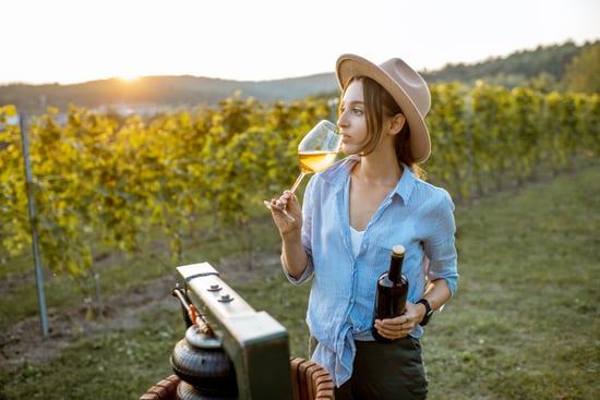 woman-tasting-wine-on-the-vineyard-2022-01-18-23-48-06-utc